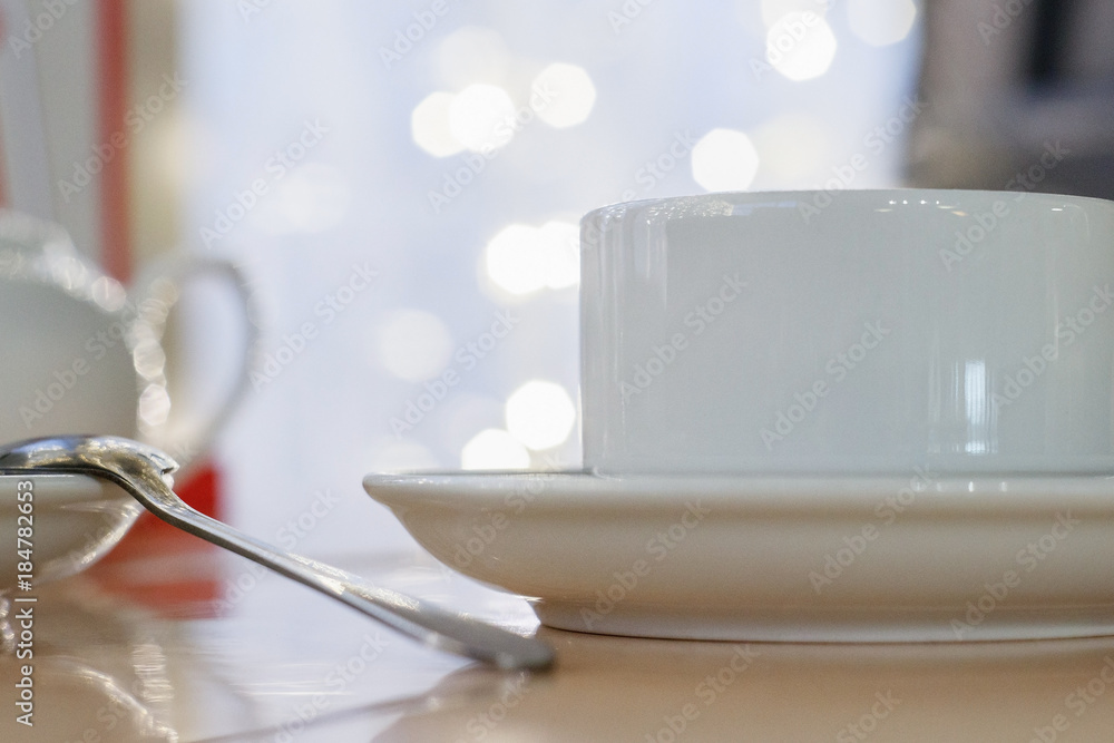 white Cup on table in cafe