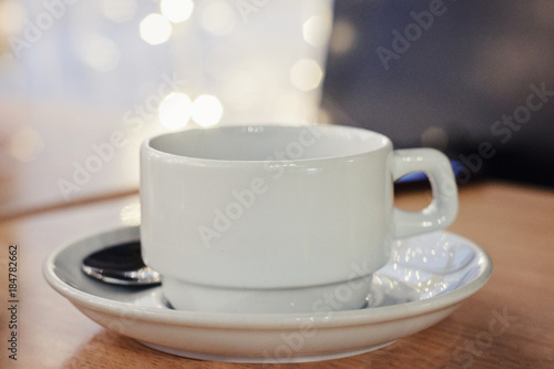 white Cup on table in cafe