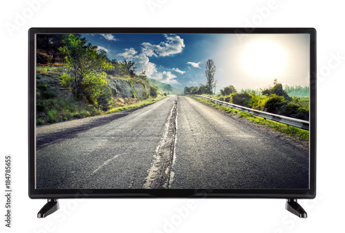 Flat high definition TV with mountain road on the screen