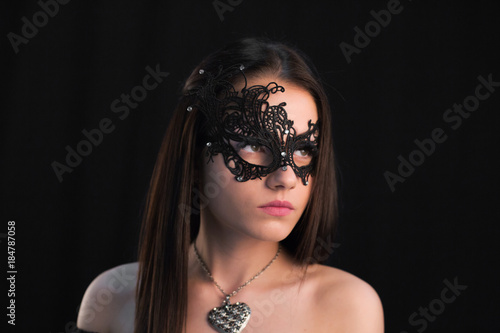 Young Mystic woman posing in mask