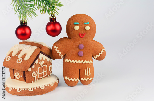 Gingerbread men and house on white background. Christmas or New Year composition. Christmas card.