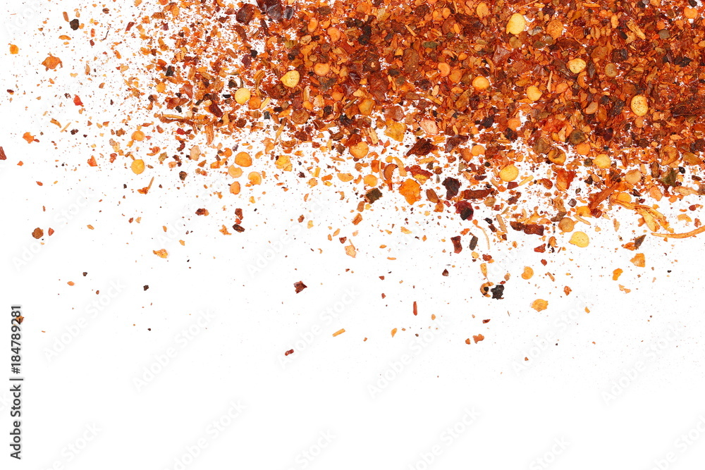 pile crushed red cayenne pepper, dried chili flakes and seeds isolated on white background, top view pile crushed red cayenne pepper, dried chili flakes and seeds isolated on white background, top view