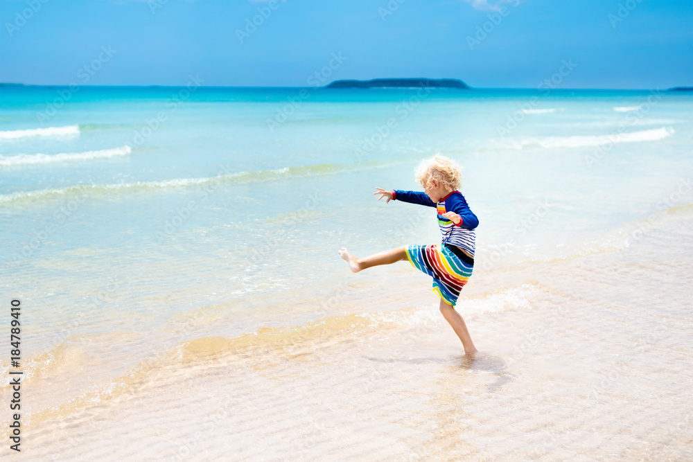Child on tropical beach. Sea vacation with kids. Child on tropical beach. Sea vacation with kids.