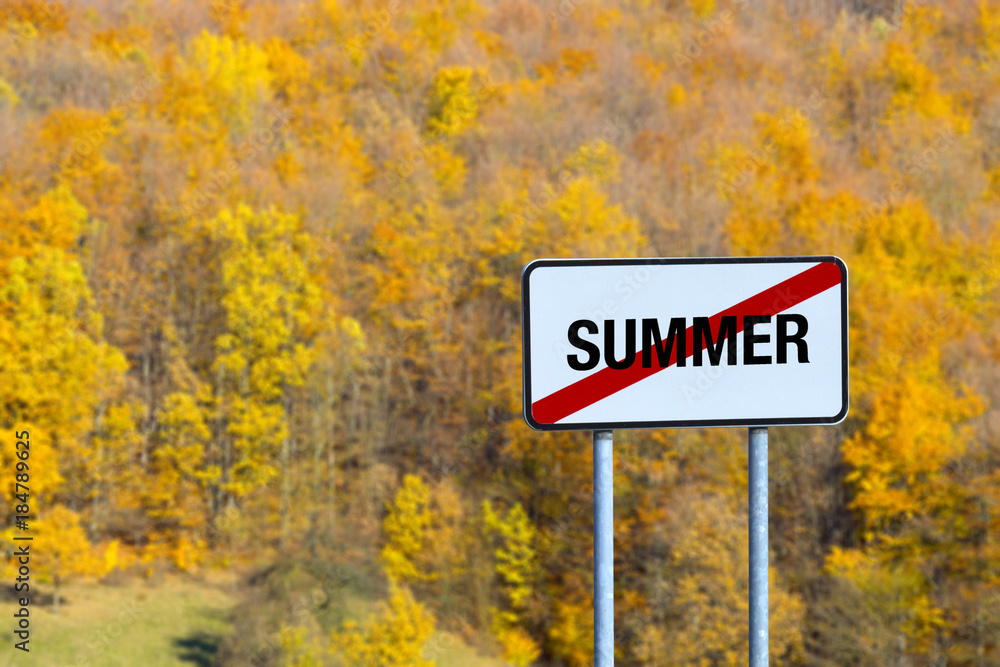 road sign  pointing to the end of the summer