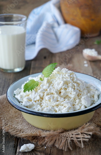 Fresh cottage cheese in an iron bowl