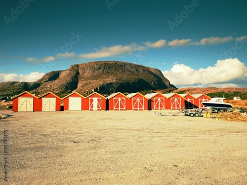 Foto Traditional red and white houses in small fishing village