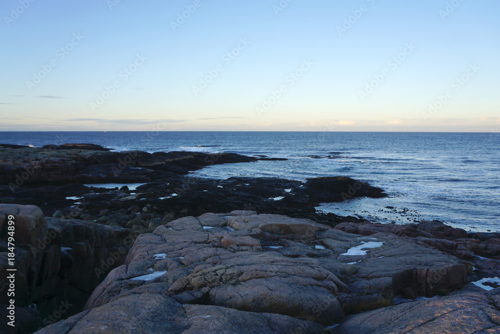 Landscape of round shape rocks beach at Barents sea in Terriberka