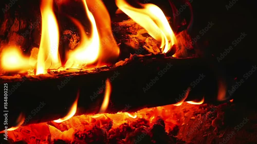 Beautiful warm orange flames in open fireplace. Shot in super slow motion. Beautiful warm orange flames in open fireplace. Shot in super slow motion.