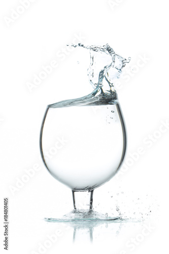 A glass of water, a splash of water