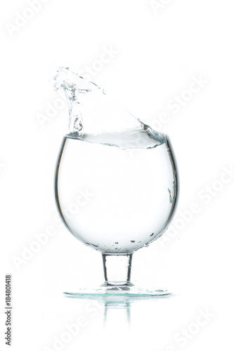 A glass of water, a splash of water