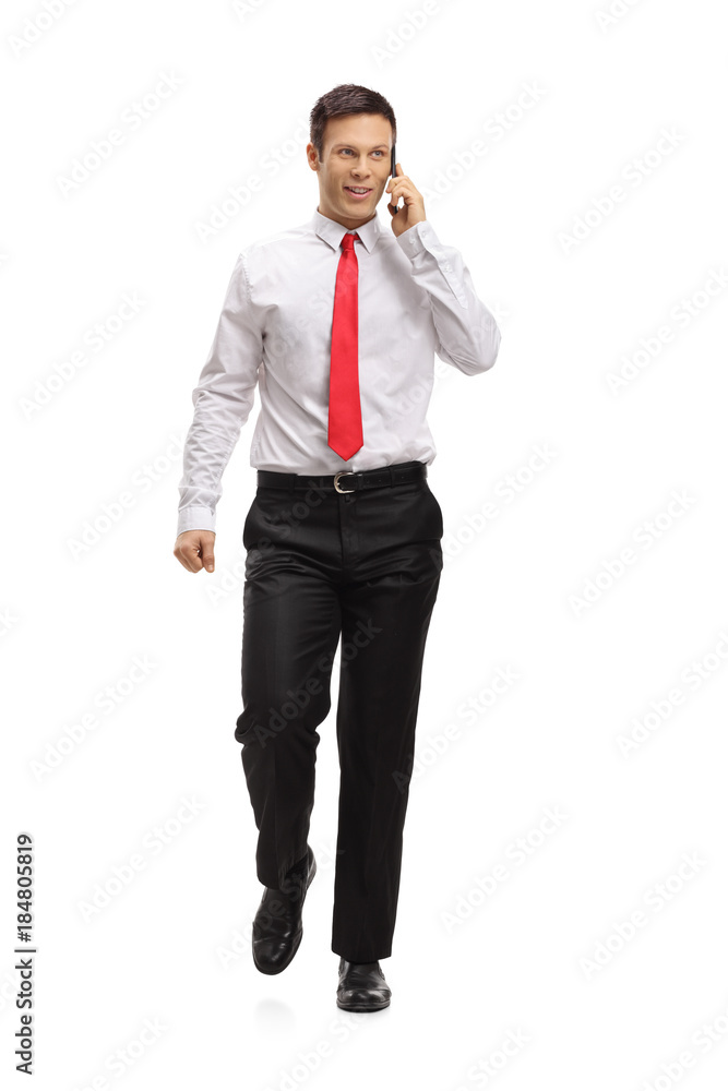 Elegant man walking and talking on a phone Elegant man walking and talking on a phone