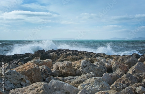 Waves splash onto rocks