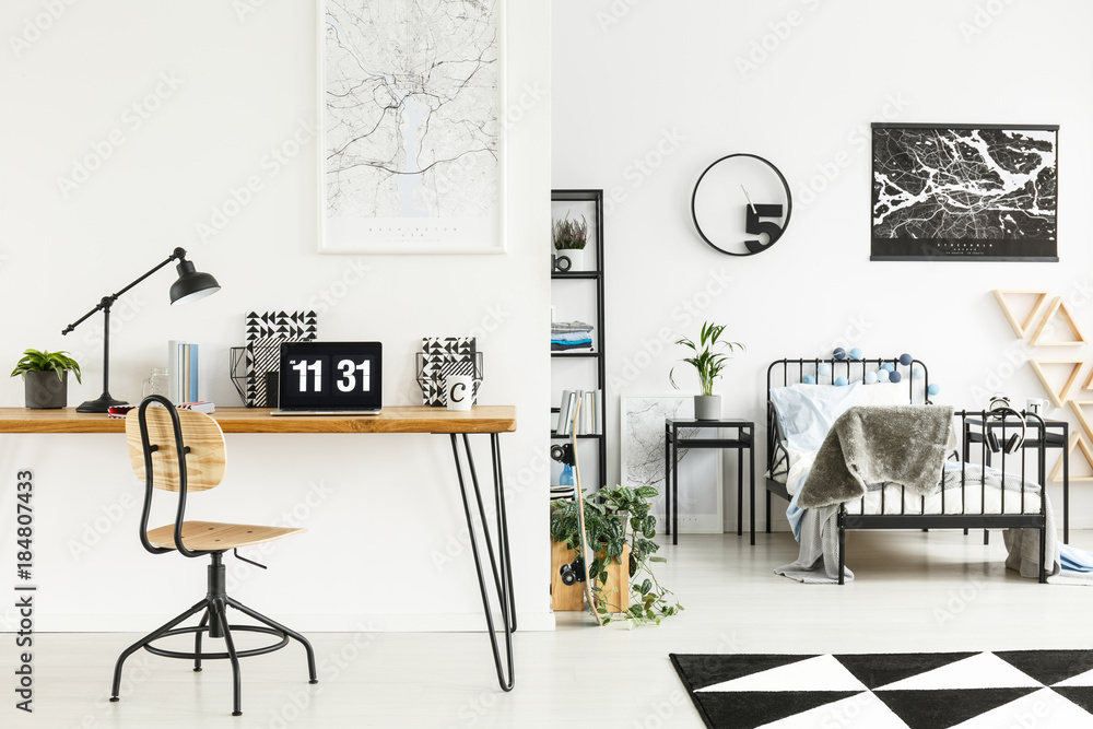 Fototapeta premium Laptop in simple boy's bedroom