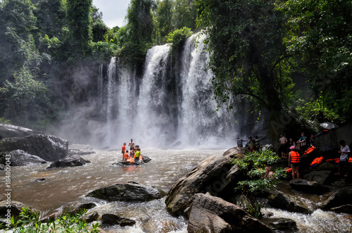 Travel and vacation in Cambodia.  Local people swimming at Phnom Kulen waterfall in Phnom Kulen National Park , Cambodia photo