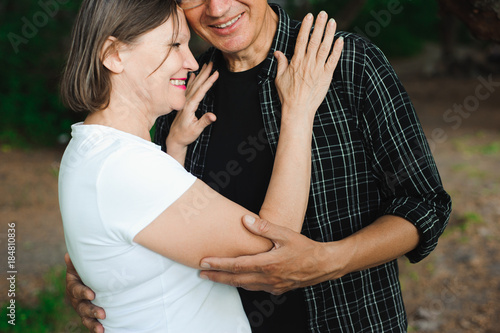 Senior couple walking together in a forest, close-up