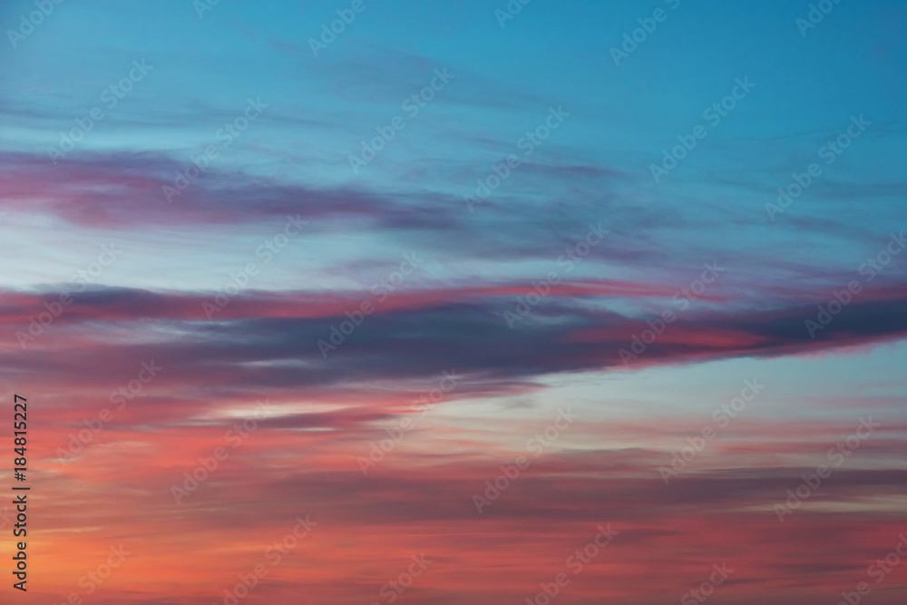 Beautiful blue sky with clouds at sunset time. Cloudy sky background.