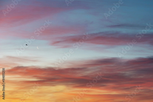 Beautiful blue sky with clouds at sunset time. Cloudy sky background.