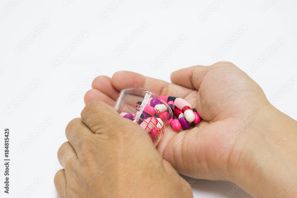 The many pill and capsules in hand man - isolated white background The many pill and capsules in hand man - isolated white background