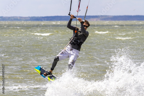 Kiteboarding. Fun in the ocean  Extreme Sport Kitesurfing. Closeup Darkslide.