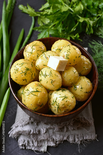 Tasty boiled potatoes with dill and butter