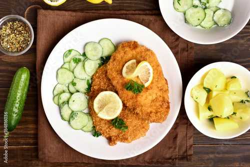Schnitzel with cucumber salad and boiled potato