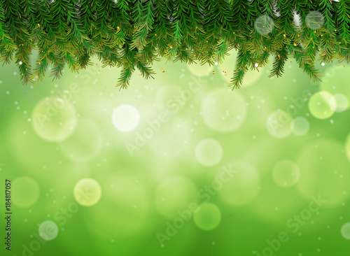 Green bokeh background with Christmas tree 
