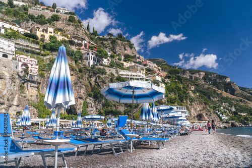 Positano, Italy - Beach with umbrellas, Amalfi coast, vacation concept