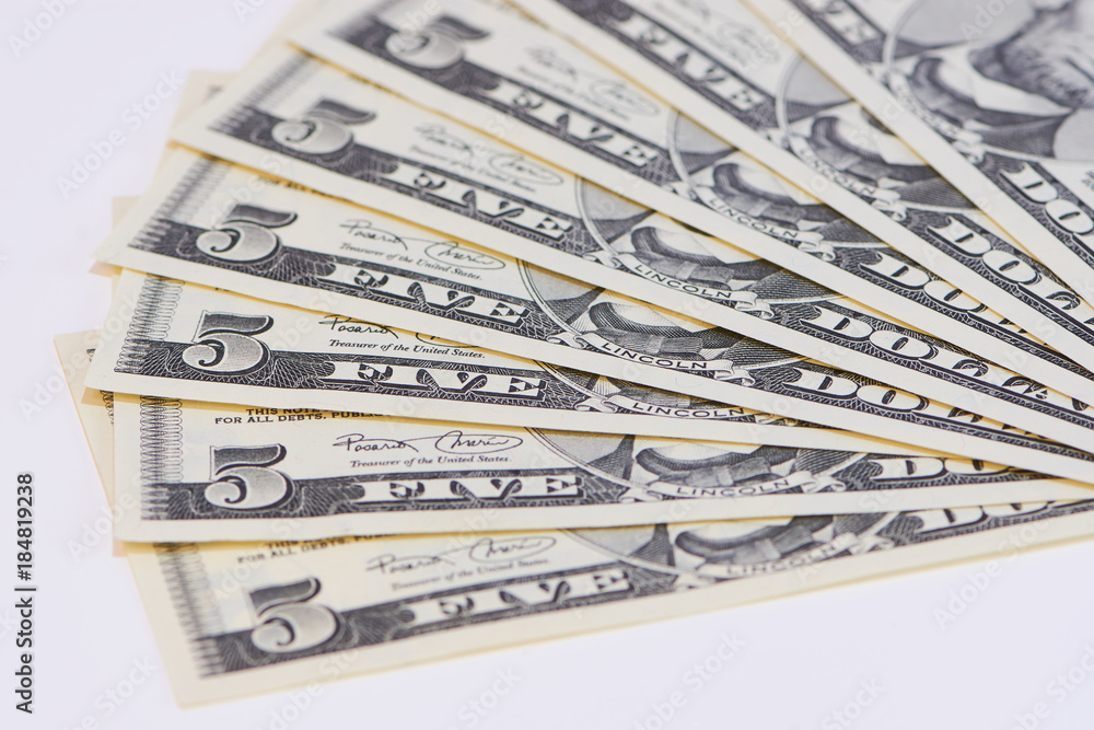 Fünf Dollar Scheine als Fächer gelegt Fünf Dollar Scheine als Fächer gelegt