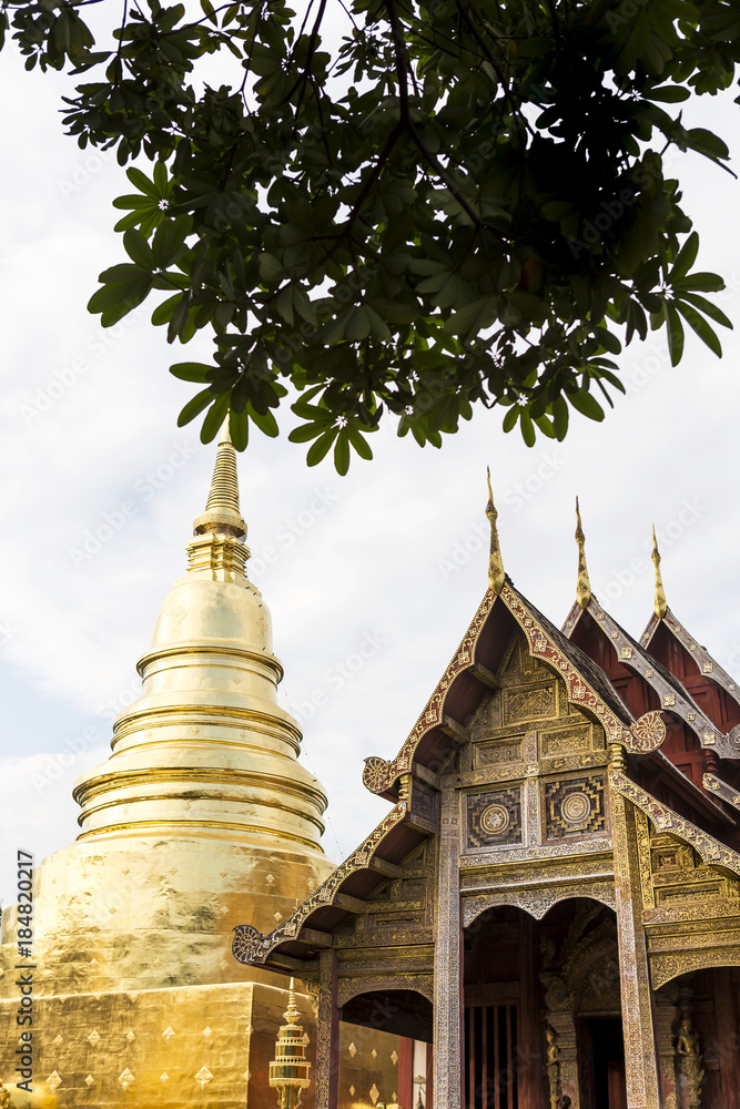 Fototapeta premium Traditional Thai style architecture public temple in North of Thailand, Wooden temple and gold pagoda