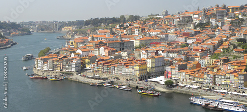 Fototapeta Naklejka Na Ścianę i Meble -  View of Praça da Ribeira, and Rio Douro from Vila Nova de Gaia, Oporto,   Portugal 