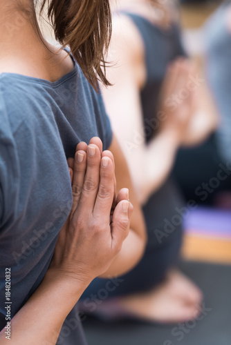 Women practicing yoga  reverse prayer pose