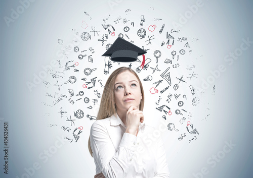 Dreamy blonde businesswoman, education photo