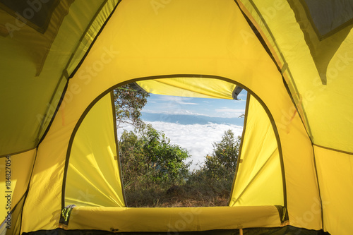 View from inside of hikers tourist tent in mountains