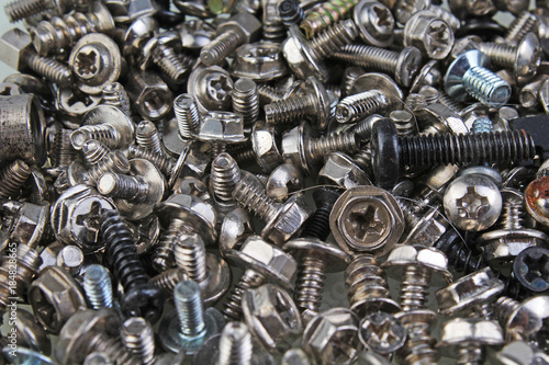 Nuts and bolts. Screw tweak bolts,twist texture pattern as background. Alloy ...