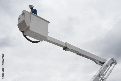 An electrician on aerial platform