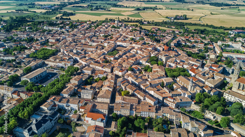 Aerial top view of residential area houses roofs and streets from above, old medieval town background, France   © Iuliia Sokolovska