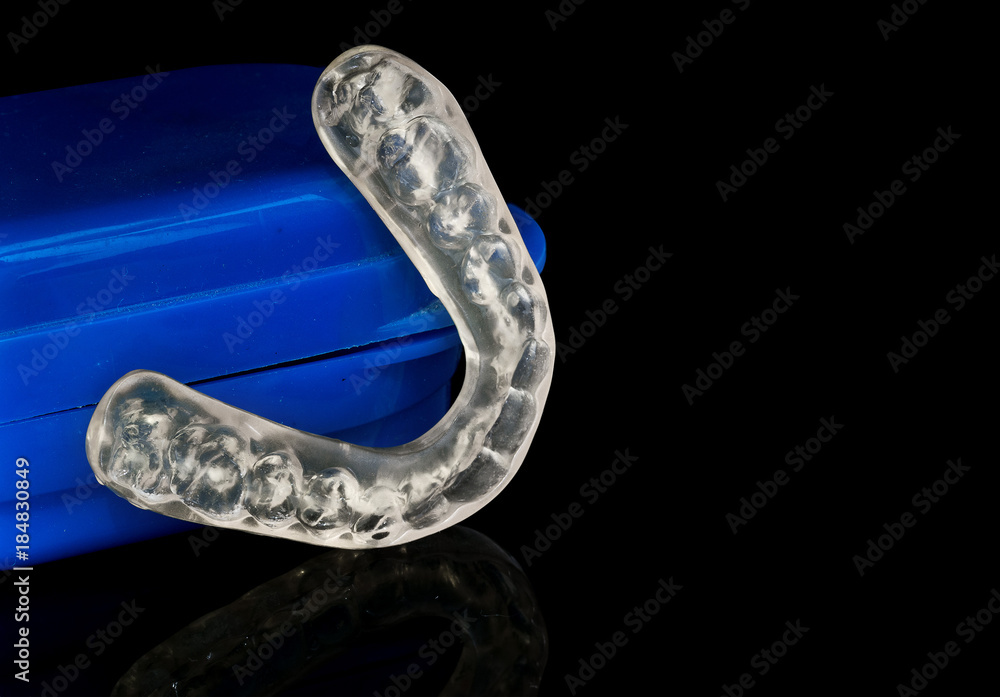 custom made wallpaper toronto digitalAcrylic transparent dental Mouth Guard on black background, showing reflection, used to treat and avoid bruxism (teeth grinding)