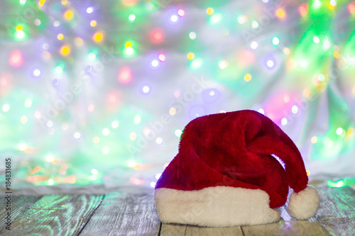 Red and white santa hat against bokeh background