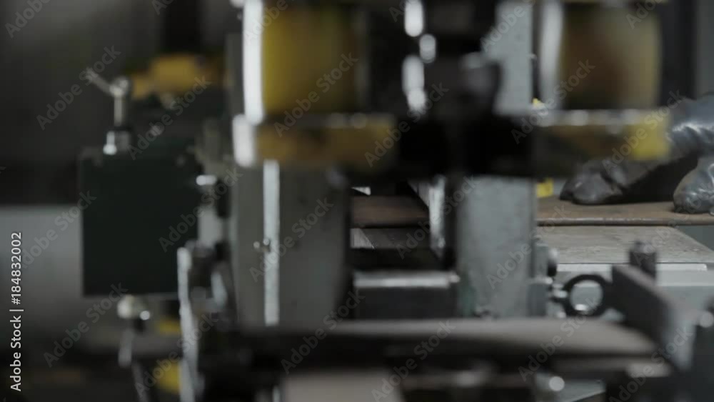 Manufacturing process cutting metal piece on modern metalworking machine Manufacturing process cutting metal piece on modern metalworking machine
