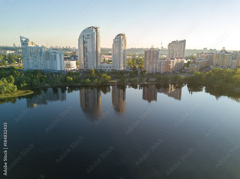 Aerial view of new modern residential Obolon district near Dnieper river in Kiev city, Kyiv cityscape from above, Ukraine
