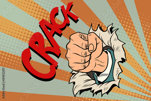 crack, a fist punches the paper