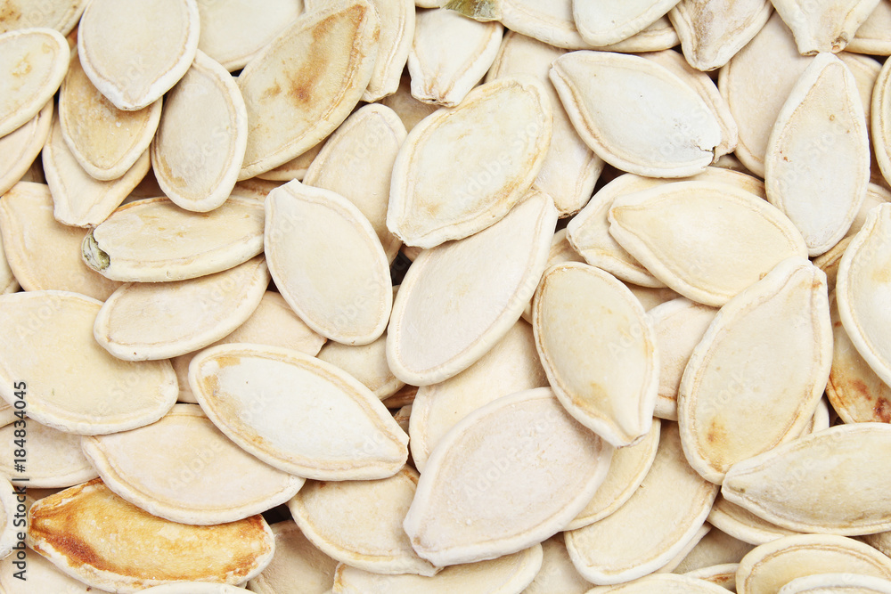 Pumpkin seeds as background. Pumpkin seed texture pattern food photo. Stack of Pumpkin seeds. Pumpkin seeds as background. Pumpkin seed texture pattern food photo. Stack of Pumpkin seeds.