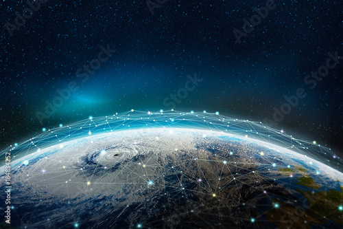Fototapeta Naklejka Na Ścianę i Meble -  A global social, information network across the planet. The earth is surrounded by a web of digital data. Elements of this image furnished by NASA