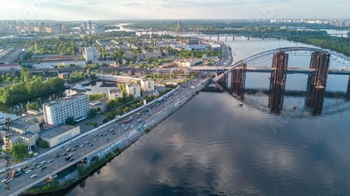 Aerial top view of Dnepr river and Rybalskiy island from above, bridges and skyline of Kiev city, Ukraine © Iuliia Sokolovska