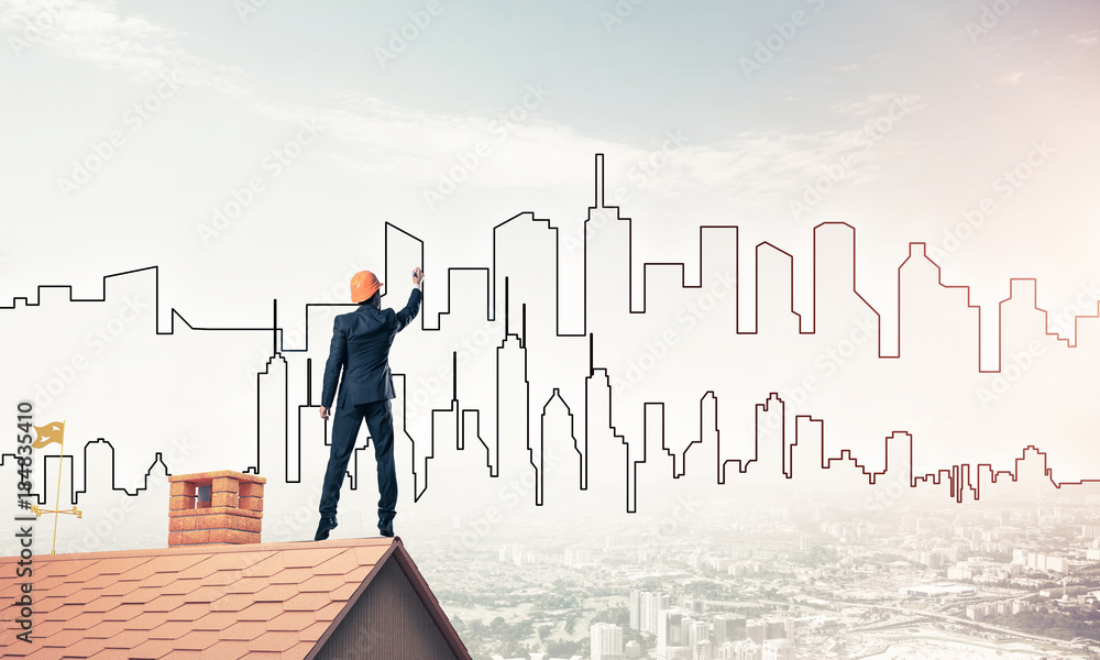 Man architect draw silhouette of modern city on blue sky. Mixed Man architect draw silhouette of modern city on blue sky. Mixed