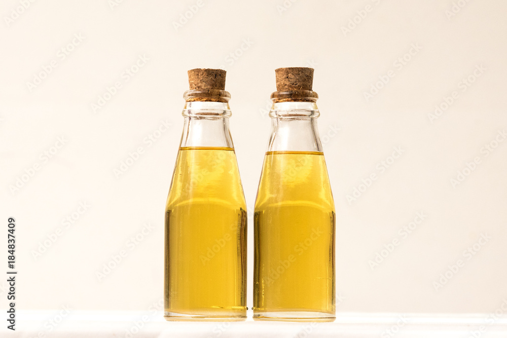 Oil in glass bottle with cork lid Oil in glass bottle with cork lid