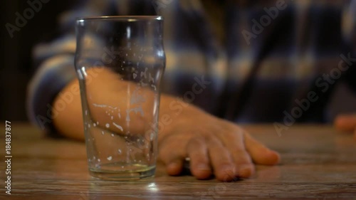 male driver drinking alcoholic beer at home or bar