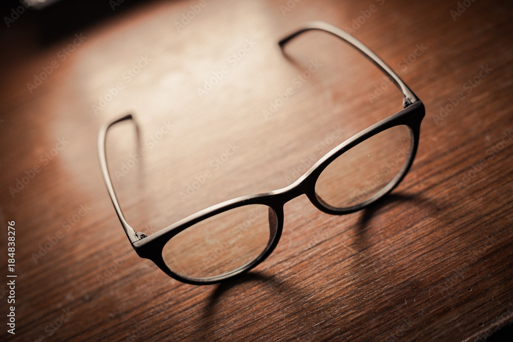 luxury eye glasses that leave after wearing on wood table luxury eye glasses that leave after wearing on wood table