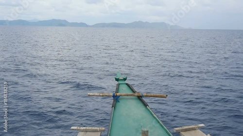 Traditional Philippine sailing ship bobbing gently above the waves, slow motion photo