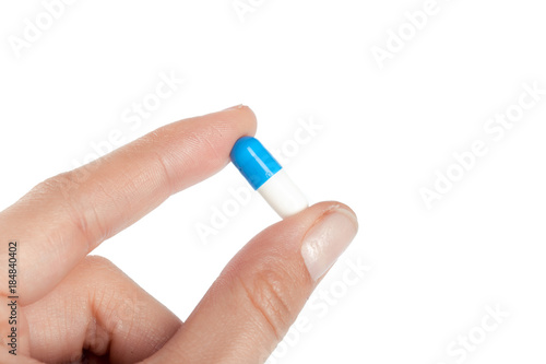 pills in woman hand